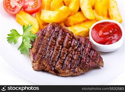 plate of grilled meat with vegetables