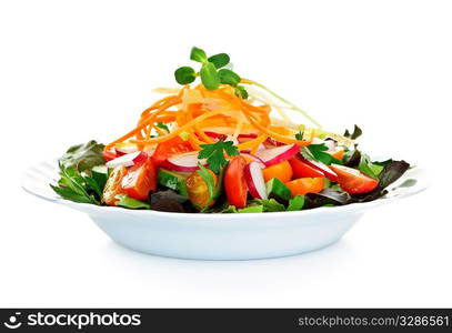 Plate of healthy green garden salad with fresh vegetables on white background