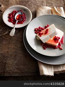 Plate of ice cream with pomegranate
