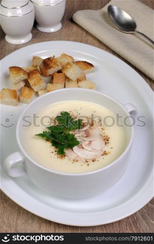 Plate of mushroom soup mashed spiced crispy bread croutons