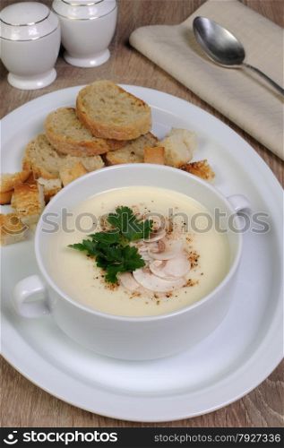 Plate of mushroom soup mashed spiced crispy bread croutons