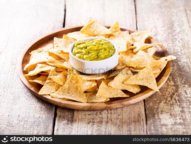 plate of nachos with guacamole