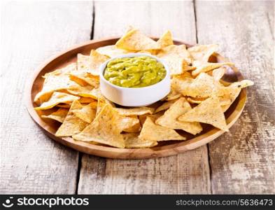 plate of nachos with guacamole