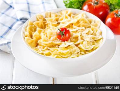 plate of pasta with cheese and tomato