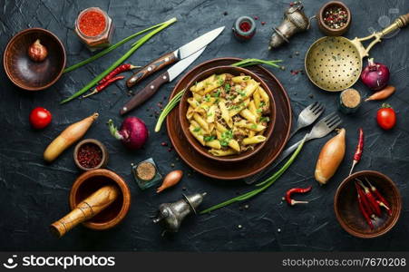 Plate of pasta with fried minced meat.Macaroni with forcemeat.. Appetizing pasta with minced meat