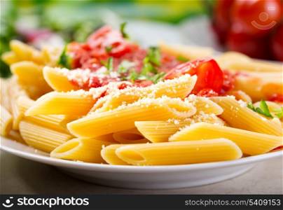 plate of penne pasta with tomato sauce