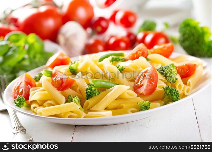 plate of penne pasta with vegetables