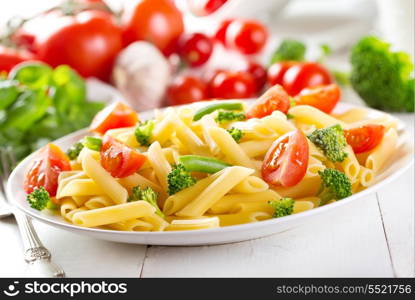 plate of penne pasta with vegetables