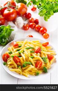 plate of penne pasta with vegetables