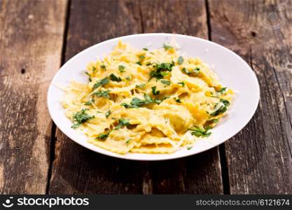 plate of ravioli on old wooden table