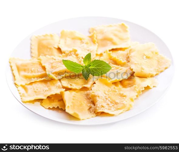 plate of ravioli with basil isolated on white background