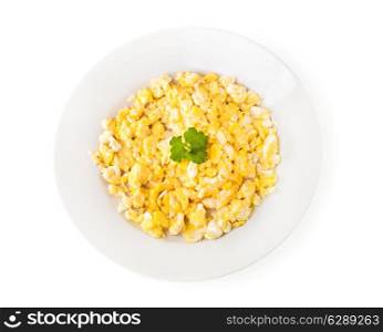 plate of scrambled eggs with parsley on white background