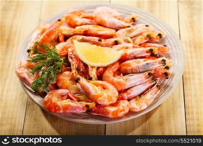 plate of shrimps on wooden table