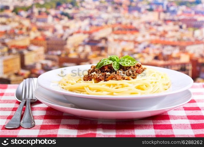 plate of spaghetti bolognese over cityscape