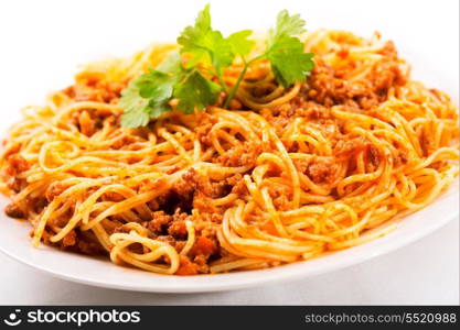 plate of spaghetti bolognese with parsley