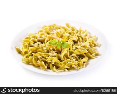 plate of spinach pasta on white background