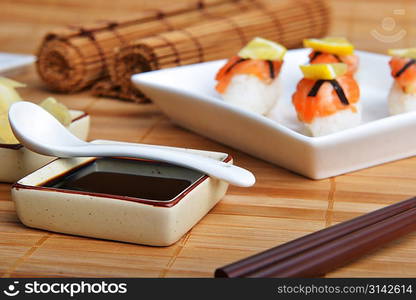 plate of sushi with salmon on bamboo napkin