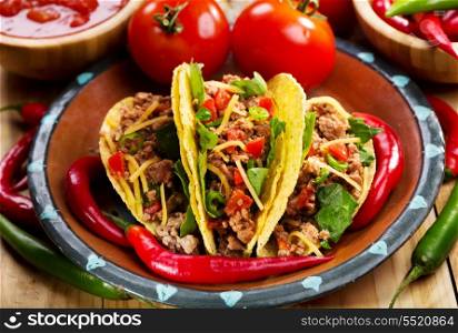 plate of tacos on wooden table