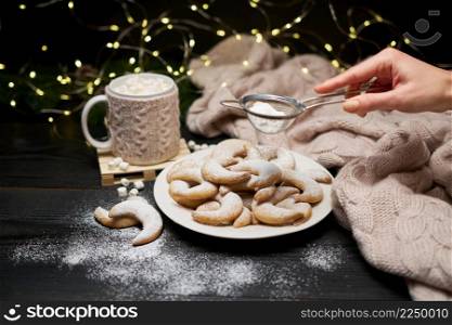 Plate of Traditional German or Austrian Vanillekipferl vanilla kipferl cookies and decorations. High quality photo. Plate of Traditional German or Austrian Vanillekipferl vanilla kipferl cookies and decorations