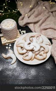 Plate of Traditional German or Austrian Vanillekipferl vanilla kipferl cookies and decorations. High quality photo. Plate of Traditional German or Austrian Vanillekipferl vanilla kipferl cookies and decorations