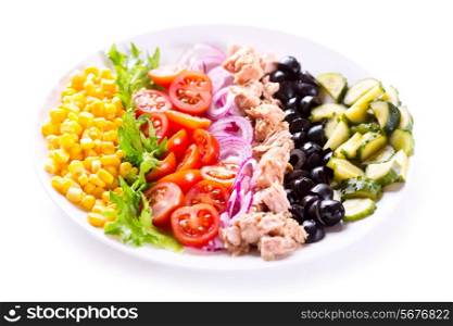 plate of tuna salad with vegetables on white background