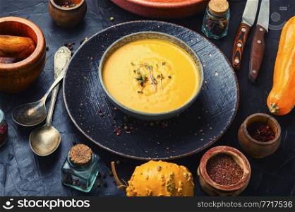 Plate of vegetarian autumn soup puree. Creamy pumpkin soup. Vegetable cream soup.. Autumn pumpkin soup