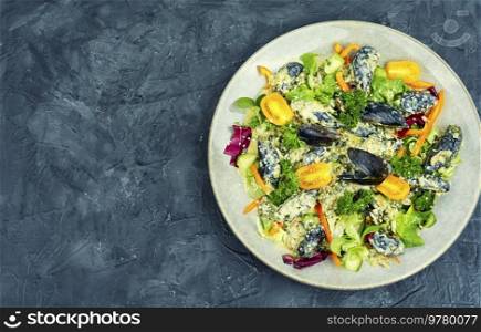 Plate with a salad of fresh vegetables, herbs and mussels.. Mix salad with seafood and vegetables,space for text