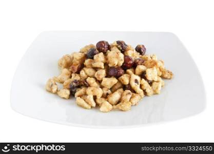 plate with chicken and nuts isolated with clipping path