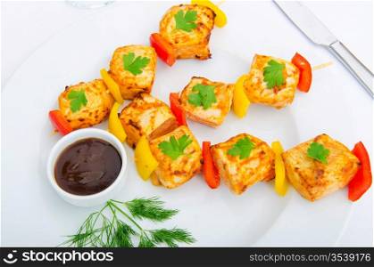 Plate with chicken kebab piecies