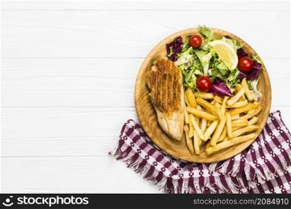 plate with chicken salad near napkin