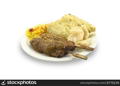 Plate with chicken satay on a white background.