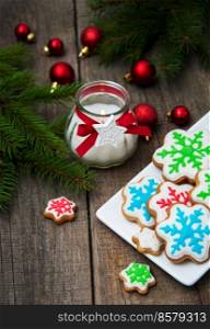 Plate with Christmas cookies on a old wooden table