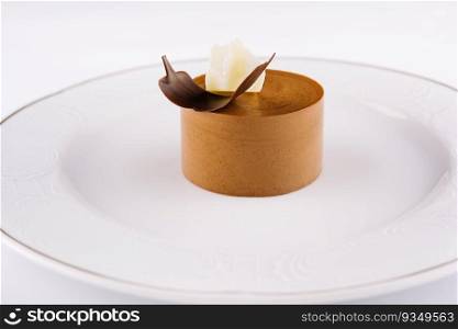 Plate with coffee panna cotta on white