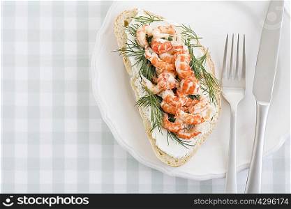 Plate with crayfish sandwich