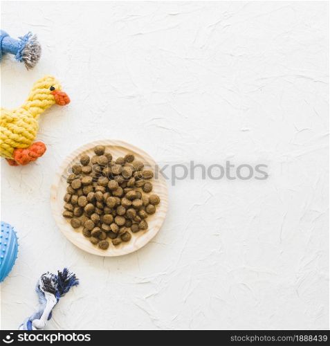 plate with food near pet toys . Resolution and high quality beautiful photo. plate with food near pet toys . High quality and resolution beautiful photo concept