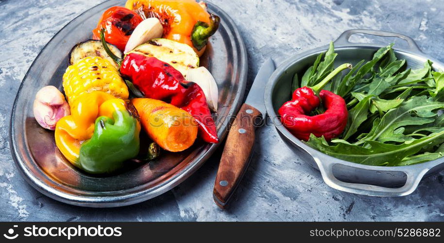 Plate with grilled vegetables. grilled vegetables on a fashionable metal tray