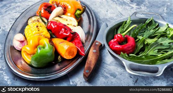 Plate with grilled vegetables. grilled vegetables on a fashionable metal tray
