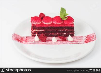 Plate with piece of delicious red velvet cake on white background. red velvet cake