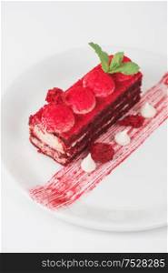 Plate with piece of delicious red velvet cake on white background. red velvet cake