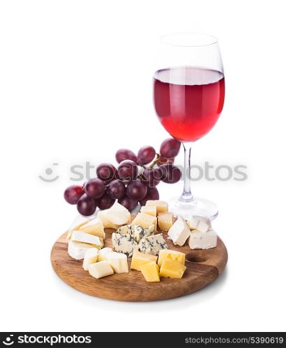 Plate with pieces of various types of cheese, grape and glass of wine, isolated on white