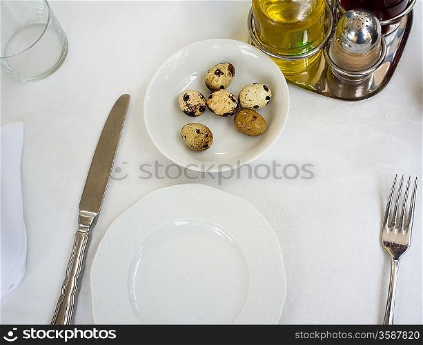 Plate with quail eggs in restaurant