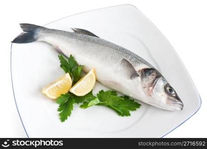 plate with sea bass, lemon and parsley isolated on white background with clipping path