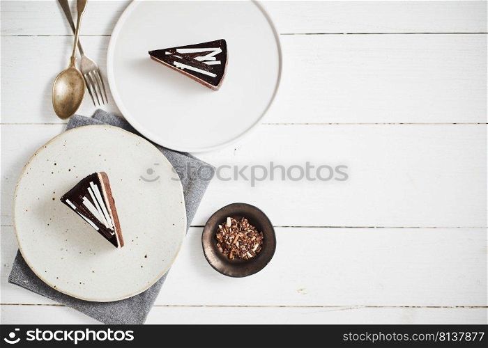 Plate with slice of tasty homemade chocolate cake on table. . tasty homemade chocolate cake.