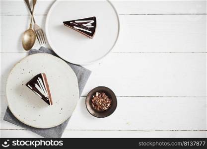 Plate with slice of tasty homemade chocolate cake on table. . tasty homemade chocolate cake.