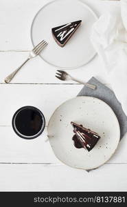 Plate with slice of tasty homemade chocolate cake on table. . tasty homemade chocolate cake.