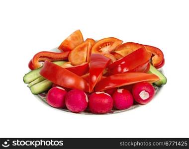 Plate with sliced ??vegetables isolated on white background, studio shot, high depth of field