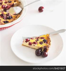Plate with tasty cherry cheesecake pie on white background