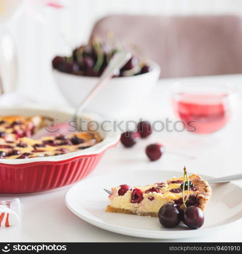 Plate with tasty cherry cheesecake pie on white background