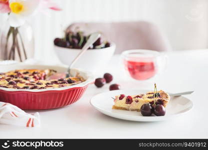 Plate with tasty cherry cheesecake pie on white background