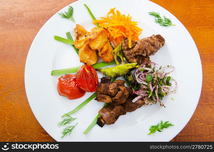 Plate with tasty lamp kebabs